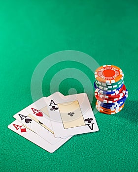 Playing cards and poker chips on table