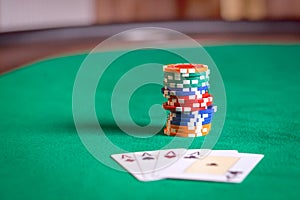 Playing cards and poker chips on table