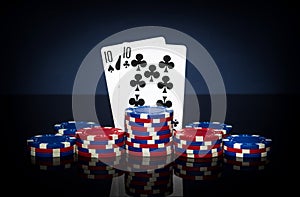 Playing cards in poker game with one pair combination. Chips and cards on black table. Successful and win
