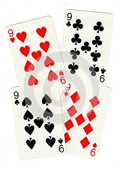 Playing cards showing four nines. photo