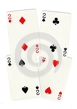 Playing cards showing four twos.