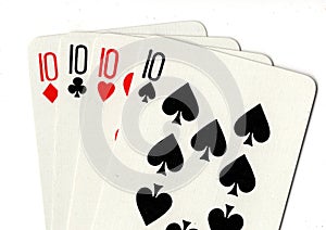 Playing cards showing a hand of four tens.