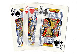 Playing cards showing three kings.