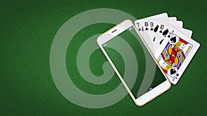 Playing cards and smartphone on a green background. Online poker concept.Online Casino. copy space. Top view. Gambling