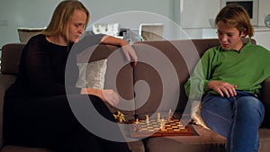 Playing chess with mom at home 5