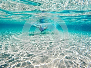 Playing in clear blue water