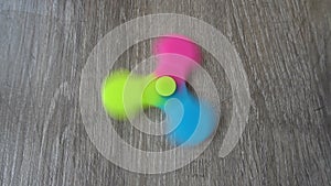 Playing with the colorful Fidget Spinner. Toy spinner