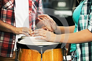 Playing congas. Close up.