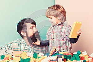 Playing with daddy. building home with constructor. child development. happy family leisure. father and son play game