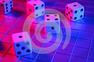 Playing Dice on a Grid in Red and Blue Lighting, Rolling Die photo