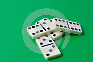 Playing dominoes on a wooden table. Dominoes game concept