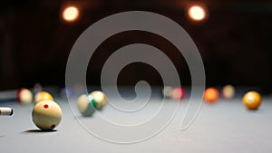 Playing Eight-ball pool billiards in a bar