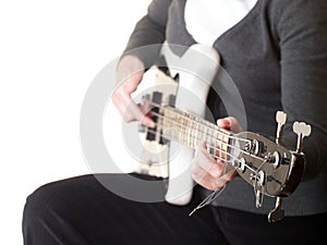 Playing electrical bass guitar isolated