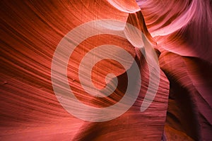 Playing the flaming wave of the underground labyrinth of the sand walls of Lower Antelope Canyon in Page Arizona is the real art