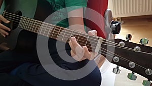 Playing guitar closeup
