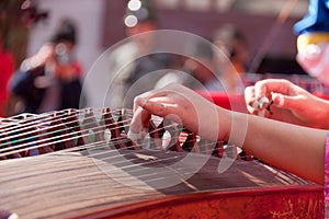 Playing guzheng photo