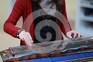 Playing the guzheng
