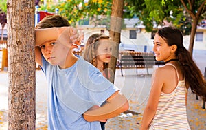 Playing hide and seek. boy closed eyes his hands photo