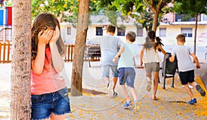 Playing hide and seek. Girl covering eyes her hands