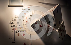 playing house of cards in vertical stacking pyramid shape to make meditation from leaisure