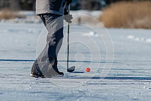 Playing ice street hockey on the frozen lake