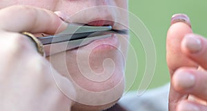 Playing the khomus in the mouth