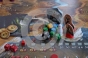 Playing Legends of Andor board game dices, figures and tiles, map