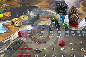 Playing Legends of Andor board game dices, figures and tiles, map