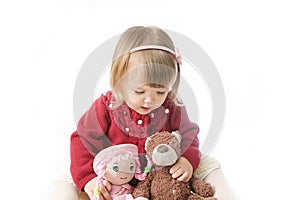 Playing little girl. cute caucasian baby with bear and doll  on white background