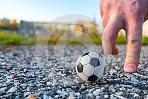 Playing minifootball with small ball hands on the street