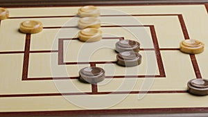 Playing nine men Morris board game