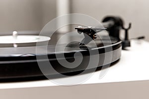 Playing an old vinyl. Dust on the turntable. Needle close-up