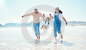 Playing, parents and girl in water at beach for bonding, quality time and summer adventure together. Travel, family and