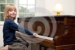 Playing piano music, boy Child instrument