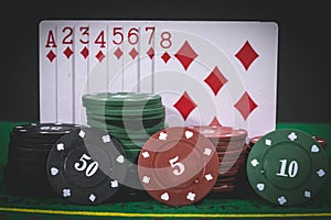 Playing poker Chips, money and cards on the table.