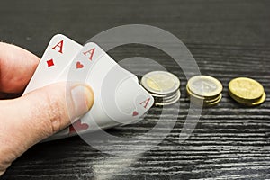 Playing poker - the player receives two aces.