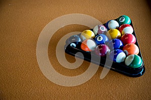 Playing pool, Billiard. Billiard balls in a triangle. Arranged billiard balls. a snooker balls and table.