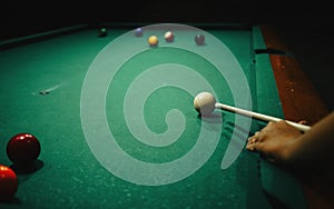 Playing pool in a night pub