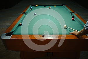 Playing pool in a night pub