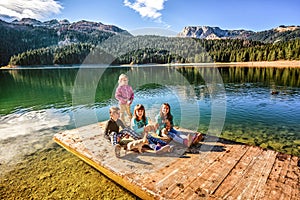 Playing with puppies on Black Lake in Durmitor,Montenegro