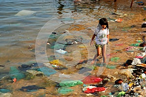 Playing among rubbish