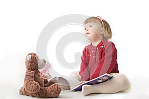 Playing school with toys. happy smiling baby girl elegant in dress. cute caucasian baby with teddy bear