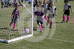Little girls playing soccer