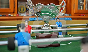 playing soccer for a winning a trophy