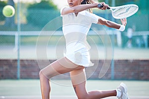 Playing, sport and woman in tennis for fitness, training and competition on a court. Exercise, cardio and professional