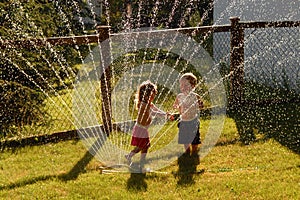 Playing In A Sprinkler