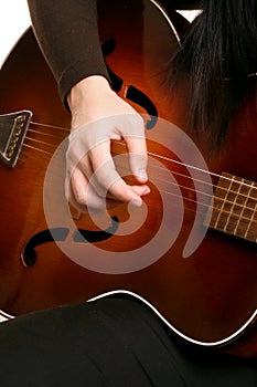 Playing strumming a guitar