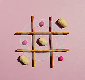 Playing tic-tac-toe with food sweets