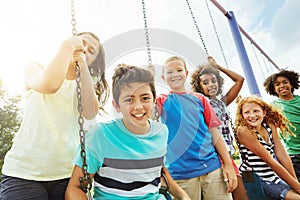 Playing together fosters a childs social and emotional development. Portrait of a group of young children playing