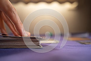 Playing trading card game on a table